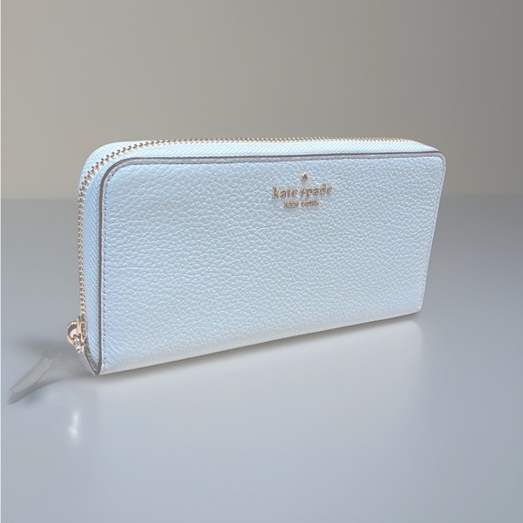 kate spade Handbags - NWT Kate Spade Robin Egg Blue Leather Long Wallet w/ Glitter Box
